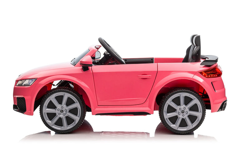 Kids ride one electric car in Pink